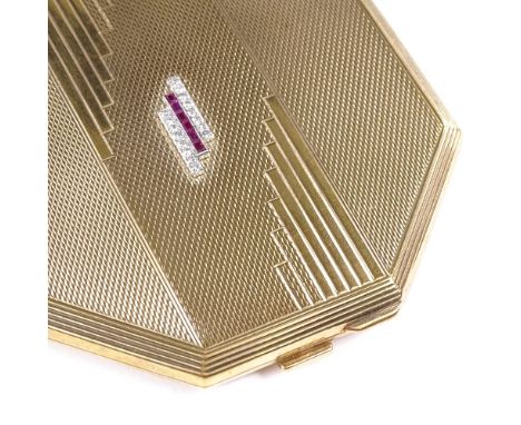 An Art Deco 9ct gold octagonal lady's compact, lid set with rows of calibre-cut rubies and round-cut diamonds, engine turned 