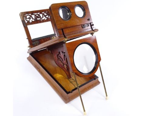 A Victorian mahogany table-top stereoscopic card viewer, with pierced fretwork panel and ivory knobs, 38cm x 22cm 