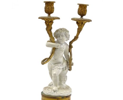 A 19th century bisque porcelain and ormolu-mounted twin-branch candelabrum on fluted yellow marble column base, overall heigh