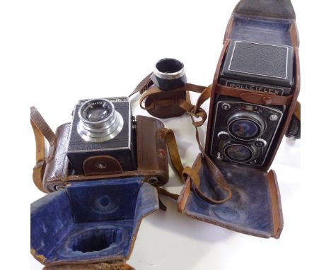 A Rolleiflex twin lens reflex camera, serial no. 1091300, leather-cased, and a Reflex-Korelle camera in original leather case