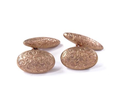 A pair of 9ct rose gold bombe cufflinks, floral engraved panels, hallmarks Birmingham 1907, oval panel length 17.5mm, 8.1gBot