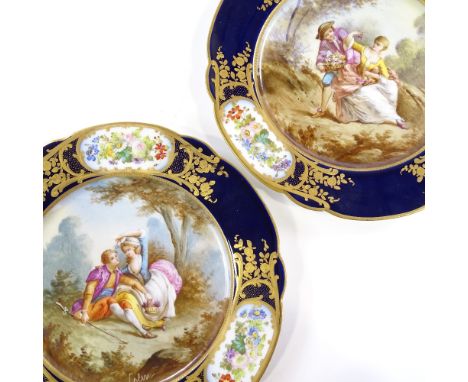 A pair of 19th century Sevres cabinet plates, hand-painted romancing couple central scenes with floral surround and gilding, 