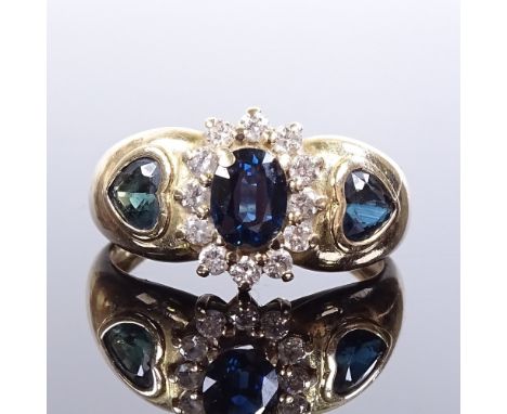 A 9ct gold sapphire and diamond cluster ring, with heart-cut sapphire shoulders, maker's marks H Ltd, hallmarks London 2000, 