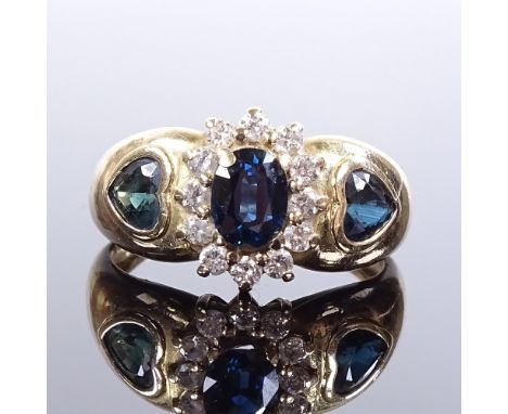 A 9ct gold sapphire and diamond cluster ring, with heart-cut sapphire shoulders, maker's marks H Ltd, hallmarks London 2000, 