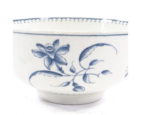 An 18th century Worcester blue and white porcelain bowl, with painted floral motifs, crescent mark, 16cm across, height 7.5cm