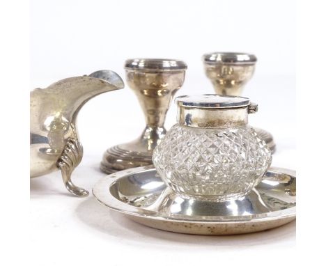 An Edwardian silver and cut-glass inkwell, a small silver sauce boat and a pair of silver-mounted squat candlesticks, stick h