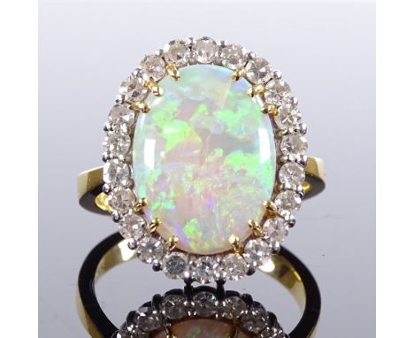 An 18ct gold cabochon opal and diamond cluster panel ring, total diamond content approx 0.6ct, setting height 18.9mm, size N,