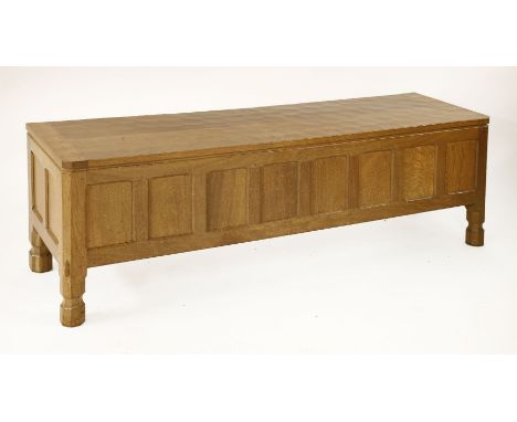 A Robert 'Mouseman' Thompson blanket chest,with an adzed top and panelled front and sides,137cm wide39.5cm deep46cm highBough