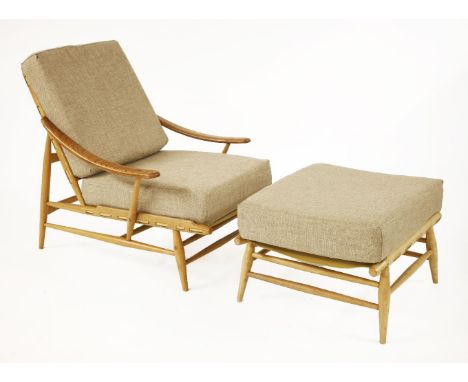 An Ercol 442 recliner and ottoman,designed by Lucien Ercolani, with buff cushions (2)