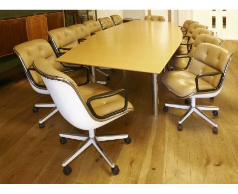 A large boardroom table, in two parts, raised on chrome supports, andthirteen 'Executive' chairs, designed by Carl Pollock fo
