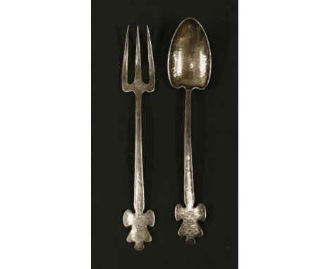 A silver fork and spoon,by Liberty & Co., London 1899,with a hammered finish, both with initials 'LMF' to the terminals,17cm 