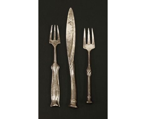 An Arts & Crafts silver butter knife and matching pickle fork,by Omar Ramsden and Alwyn Carr, London 1913,both with hexagonal