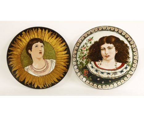 Two pottery chargers,dated 1880, each painted with ladies by Arthur Midgley (1852-1919), one wearing a daisy chain with flowi