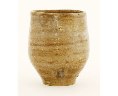 A stoneware vase, possibly Lucie Rie, with a lined brown glaze, impressed maker's mark,7cm high