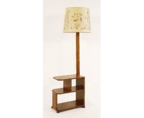 An Art Deco walnut standard lamp,with a shelf base and découpage shade,174cm high