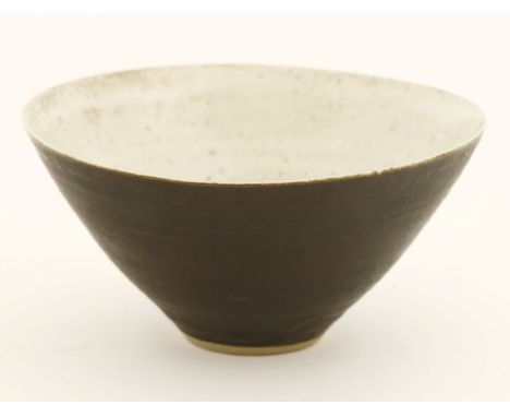 *An earthenware bowl, by Lucie Rie (1902-1995), with a brown glazed exterior and oatmeal glazed interior, impressed monogram,