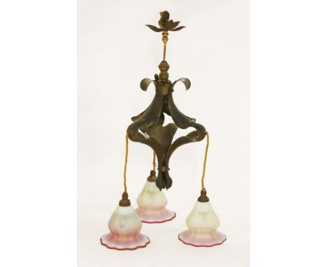 An Art Nouveau ceiling light,probably by W A S Benson, with three vaseline glass shades with raspberry edges,48cm high overal