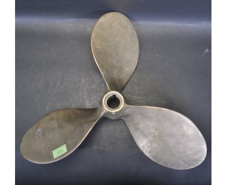A vintage retro mid 20th century solid bronze boat / ship's propeller having three-bladed design with central hub. Measures 1