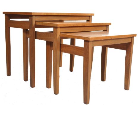 A vintage retro 1970’s danish inspired teak wood nest of tables. The three graduated tables having a rectangular top raised o