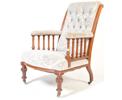 A late 19th century Victorian library chair / easy chair / armchair. The chair having fabric upholstery with button backrest,