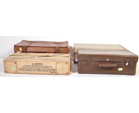 A vintage retro mid 20th century brown leather and brass suite case. The suite case of a rectangular form with brass locks, s