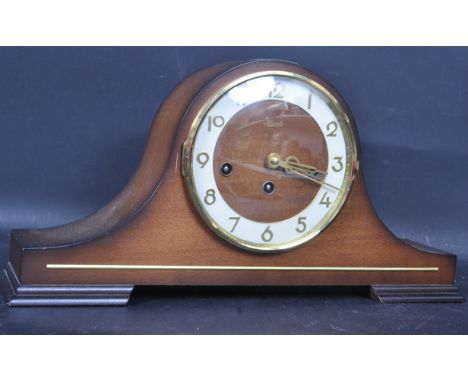 A late 20th century German made Franz Hermle Napoleons hat mantel clock having a Westminster chime having a brass and white e