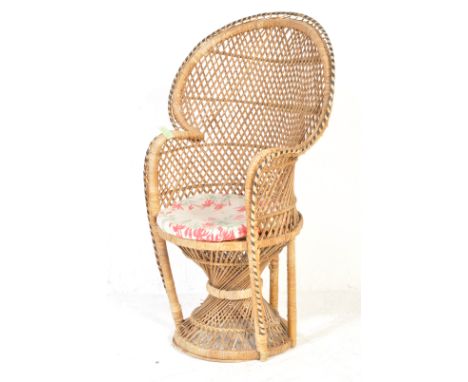 A retro vintage mid 20th century circa 1970s childrens bamboo peacock chair having a hoop back with latticework, cushioned se