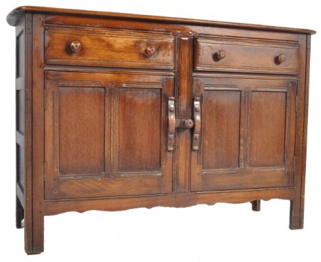 A vintage retro mid 20th century &nbsp;Ercol Old Colonial beech and elm sideboard having twin cupboards with short drawers ab