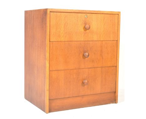 A vintage retro mid 20th century circa 1960’s Herbert E Gibbs oak pedestal bedside chest of drawers. The chest of a pedestal 