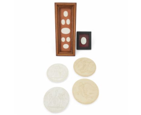 Seven plaster medallions within a wooden frame, together with another framed medallion, pair of Royal Copenhagen bisque porce