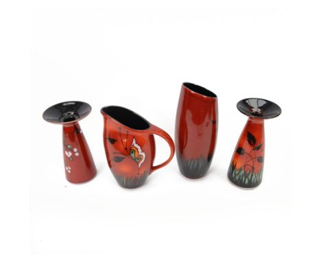 Two Poole Pottery vases decorated in Butterfly pattern, together with matching jug and another Poole Pottery vase decorated i