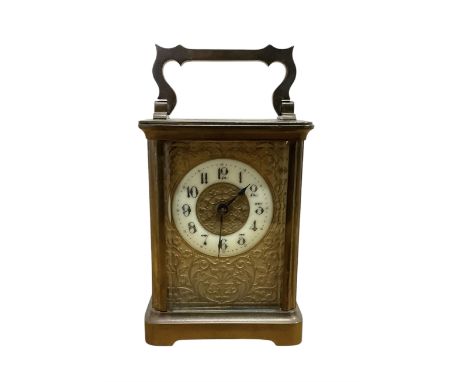 French - early 20th century brass cased carriage clock in a corniche case with an etched gilt dial plate and ivorine chapter,