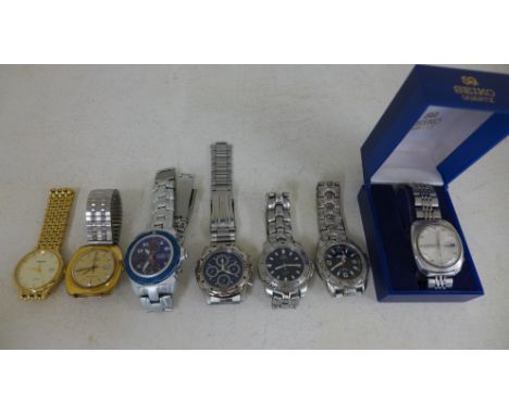 A Gents steel Seiko 5 Automatic wristwatch with date date together with a Timex Automatic, a Quartz Sector ADV 5000 steel cas