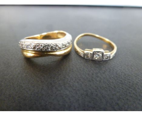 A diamond three-stone ring - Size K 1/2 - Together with a bi-colour diamond twist ring - Size L - Both with marks indicating 