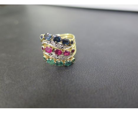 A multi-gem-set dress ring - Designed as five rings connected by a hinge and set with ruby, sapphire, emerald and diamond  - 