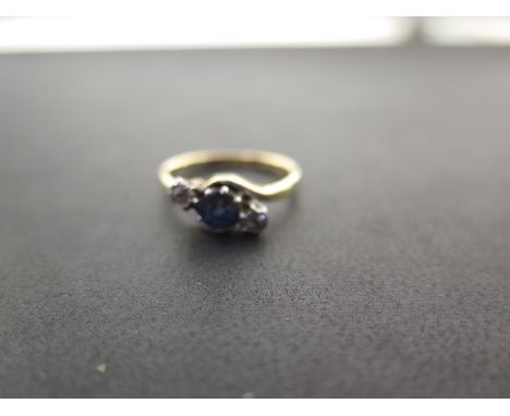 A sapphire and diamond three-stone crossover ring - Stamped 18ct and plat - Ring size M - Weight approx 3.1gms
Condition Repo