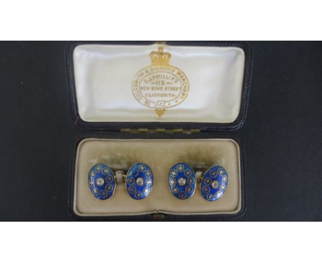 A pair of late 19th/early 20th century gold diamond and enamel cufflink's, each blue and gold enamel panel set with an old cu