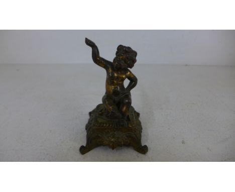 A 19th century gilt bronze figure of a seated cherub on a four legged foliate decorated stool or plinth - Approx. height 11cm