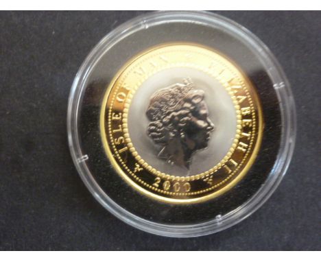 Elizabeth II Pobjoy Mint titanium and gold Millennium 2000 coin - Weight approx  9gms - 24ct gold, 2gms of titanium 
Conditio
