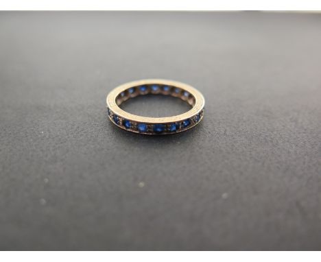 A blue-gem full-circle ring - Stamped 9ct - Ring size M - Weight approx 2.1gms
Condition Report: Good - With light scratches