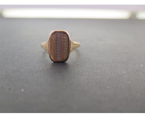 A tri-colour textured signet ring - Stamped 9ct - Ring size Q 1/2 - Weight approx 2.2gms
Condition Report: Good - With light 