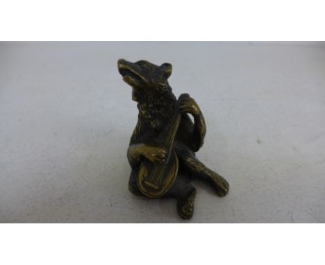 An early 20th century Continental cast bronze/brass figure of a bear playing a lute - stamped 'F' to interior -  Height 7cm 