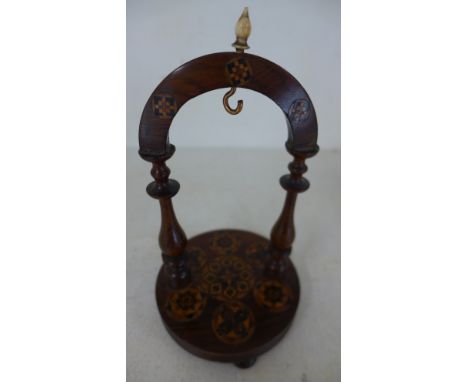 A good quality Victorian rosewood and Tunbridge ware pocket watch stand, the circular base on three turned bun feet, inlaid w