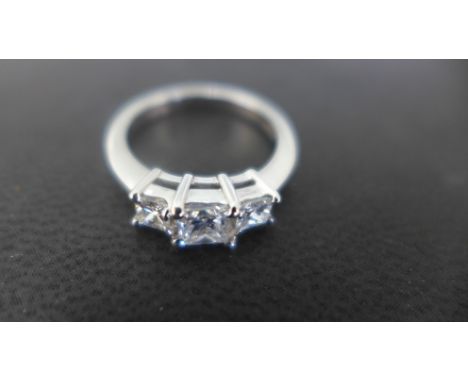 A platinum three stone diamond ring, the three square cut diamonds to shoulder, ring size K - approx diamond weight 0.85ct - 