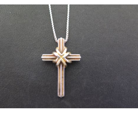 TIFFANY & CO a grooved cross pendant - Stamped Tiffany & Co 925 750 - Length 3.2cms - Suspended from an unrelated fancy-link 