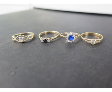 Four gem-set rings - To include sapphire, cats eye cabochon, cubic zirconia - All test as 9ct gold - Ring sizes K, N and P - 