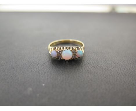 An 18ct gold opal and diamond boat-shape ring - Partial hallmark - Ring size P 1/2 - Weight approx 3.7gms
Condition Report: G