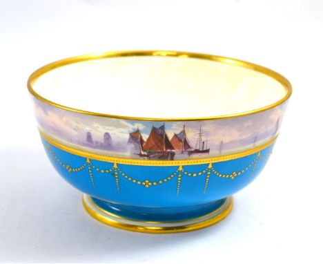 A Minton punch bowl painted with a seascape border, signed J E Dean 