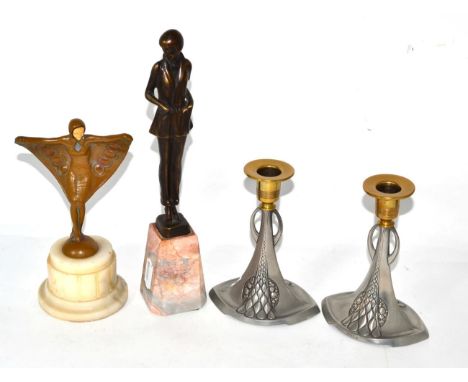 Two Art Deco style metal figures, each on alabaster base and pair of WMF candlesticks 
