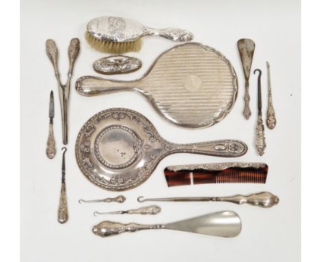 Collection of mostly early 20th century dressing table and manicure items including two silver-backed dressing table mirrors,